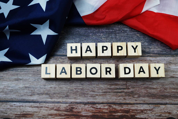 Happy Labor Day Word alphabet letters with USA flag on wooden background - Fotó, kép