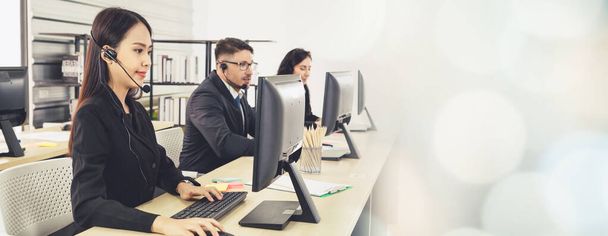 Business people wearing headset working in office broaden view - Фото, изображение