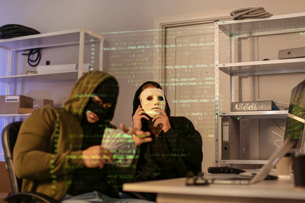 Hackers counting money in dark room with computers - Zdjęcie, obraz
