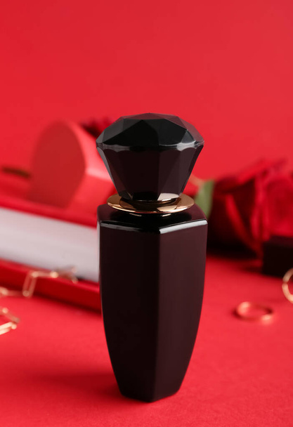 Perfume for Valentine's day on red background, closeup - Valokuva, kuva