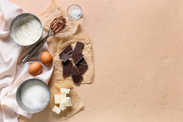 Fresh ingredients for preparing chocolate brownie on beige background - Foto, Imagem