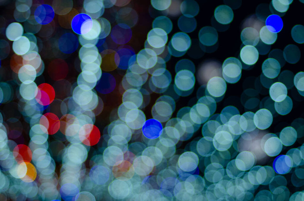 defocused night shot of festive bokeh lights  - Foto, afbeelding