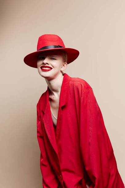 glamorous woman red jacket and hat red lips fashion isolated background - Foto, Imagem