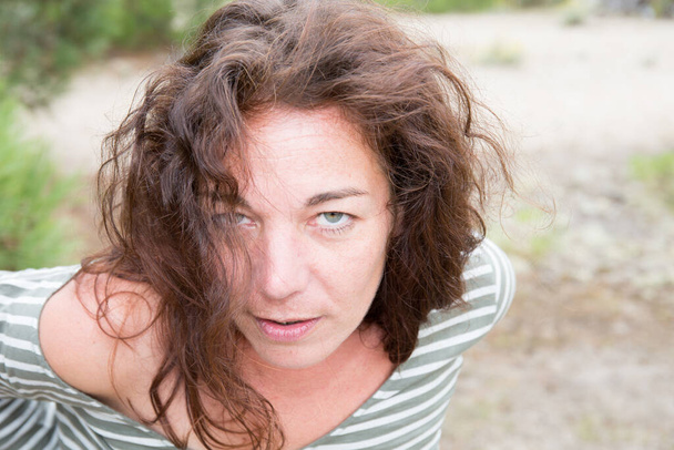 Middle Aged Woman portrait glamour face brunette curly hairs Outdoor - 写真・画像