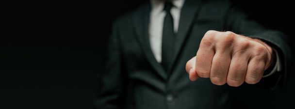 Businessman greeting with fist bump, closeup with selective focus - Foto, imagen