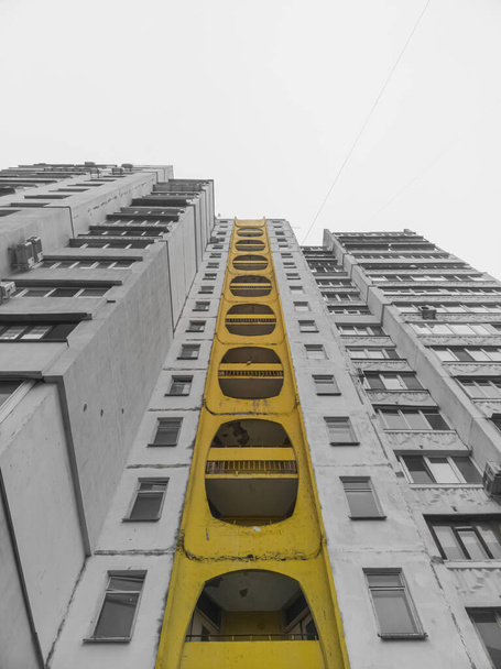 Facade of a former-soviet prefabricated apartment building. Bottom up view. - 写真・画像