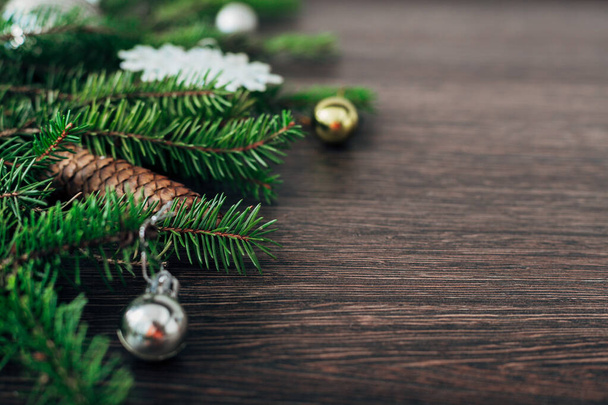 Christmas Tree Branches on a Brown Background with CopySpace for Text - Φωτογραφία, εικόνα