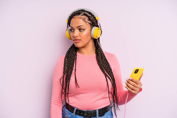 black afro woman on profile view thinking, imagining or daydreaming. listening music concept - Φωτογραφία, εικόνα