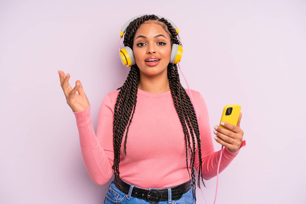black afro woman feeling happy, surprised realizing a solution or idea. listening music concept - Φωτογραφία, εικόνα