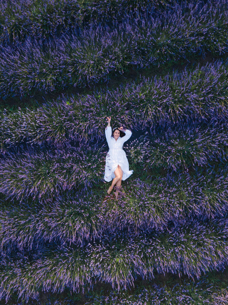 gorgeous woman in white dress at lavender field - Photo, Image