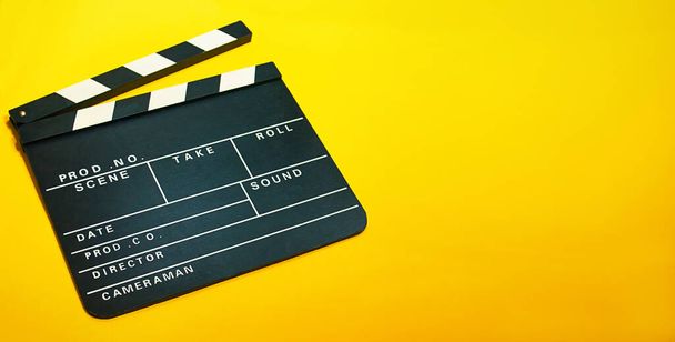 A clapperboard, symbol of filmmaking and video production. Professional type of equipment, used on films to assist in synchronizing of picture and sound - Foto, Imagen
