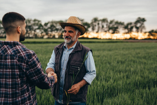 farmers handshake outdoor on filed - Valokuva, kuva
