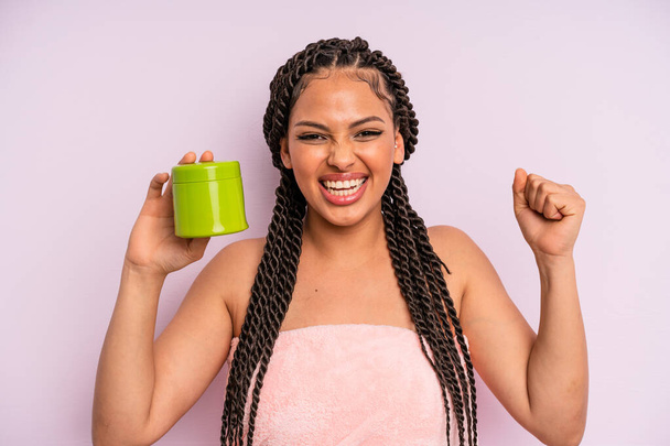 afro black woman feeling shocked,laughing and celebrating success. hair treatment concept - Φωτογραφία, εικόνα