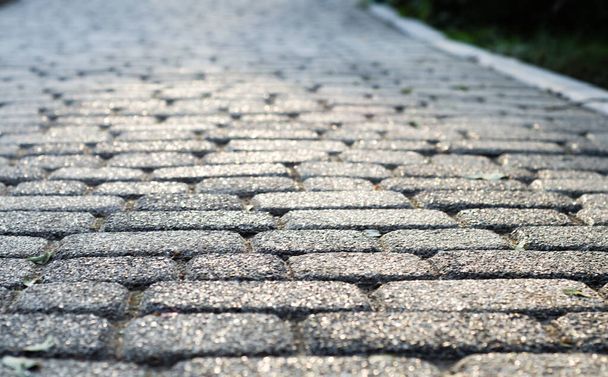 Background of paving stones. Textured gray stones close-up. Old stone road. Soft focus. - Valokuva, kuva