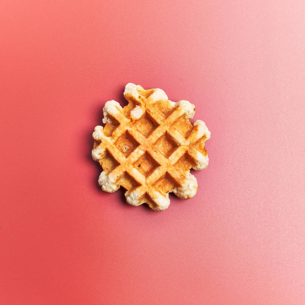  Single delicious waffle over red background - Φωτογραφία, εικόνα
