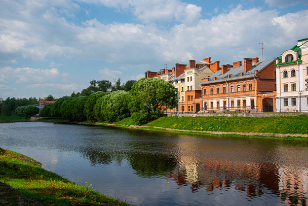 Summer sunny day. Embankment quarter on the bank of the river, a popular tourist destination, Pskov, Russia. - Photo, Image