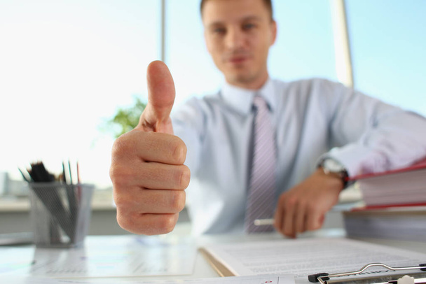 Businessman makes thumbs up gesture closeup. Successful career - Photo, Image