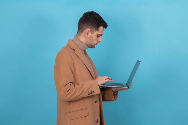 man with laptop isolated on background - Photo, Image
