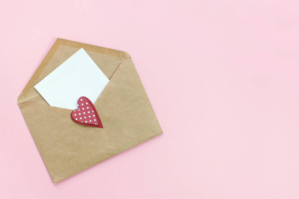 Valentine's day background. open envelope with blank note. Moke up. Flat lay - Фото, изображение