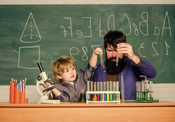 Teacher and pupil boy in chemical laboratory. Invent medicines. Pharmaceutical scientist. Science and technology for disease control. Laboratory experiment. Future wellbeing. School laboratory - Fotoğraf, Görsel