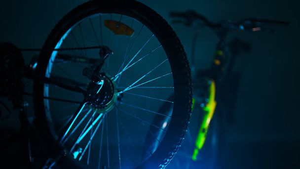 Bicycle wheel in a workshop. RGB effects. - Фото, изображение