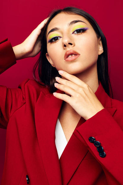 portrait pretty woman bright makeup red jacket posing studio model unaltered - Фото, зображення