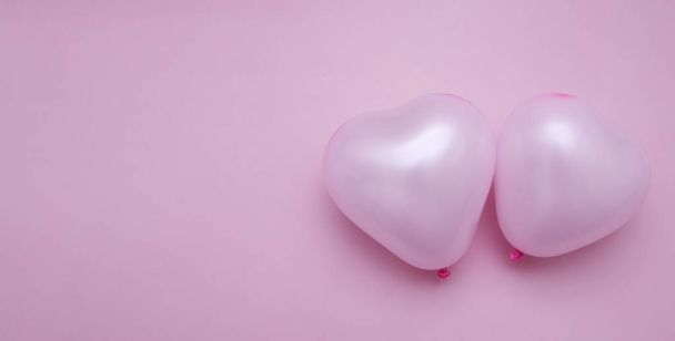 valentine's day flat lay with heart shape two balloons monochrome pink copy space banner - Foto, afbeelding