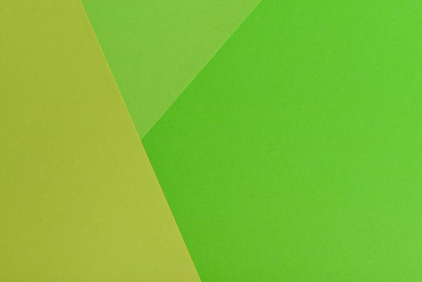Abstract geometric paper background with green and orange colors. - Fotografie, Obrázek