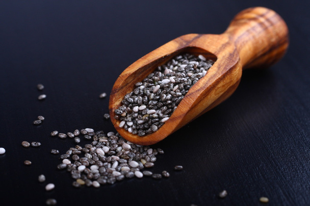 Chia seeds in wooden scoops, one of the superfoods - Photo, Image