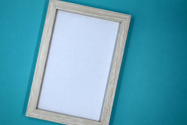 Mockup frame or poster on a blue wall background. Space for text. - Fotoğraf, Görsel