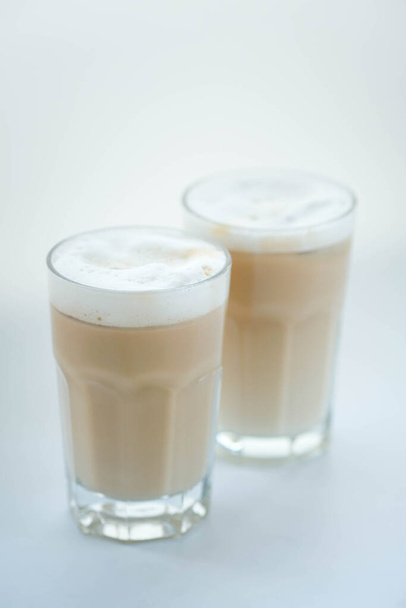 Delicious latte with milk foam on top - 写真・画像