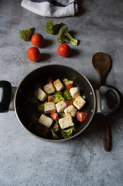 Paneer or cottage cheese cubes along with vegetable salad in a cooking pan.  - Photo, Image