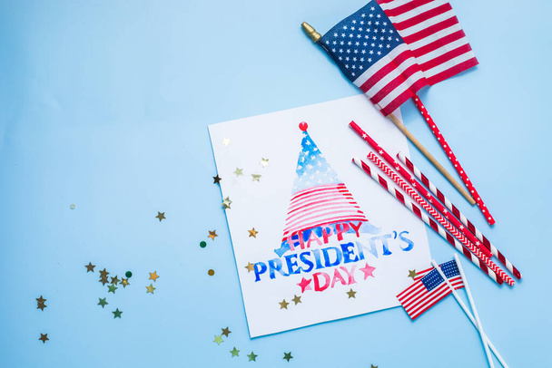 United States National Holidays. American or USA Flag with "HAPPY PRESIDENT'S DAY" text on blue  background, President Day concept - Photo, Image