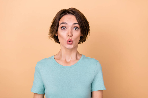 Photo of young pretty astonished woman face reaction fake information isolated over beige color background. - Foto, afbeelding