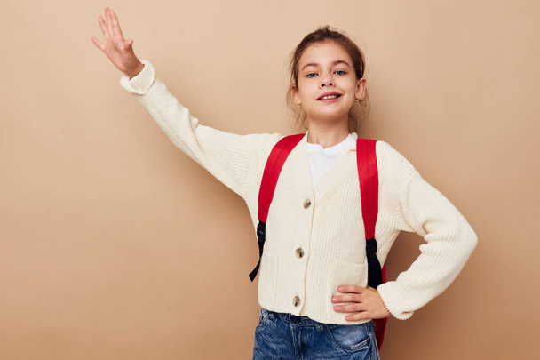 little girl schoolgirl with red backpack posing childhood unaltered - Valokuva, kuva