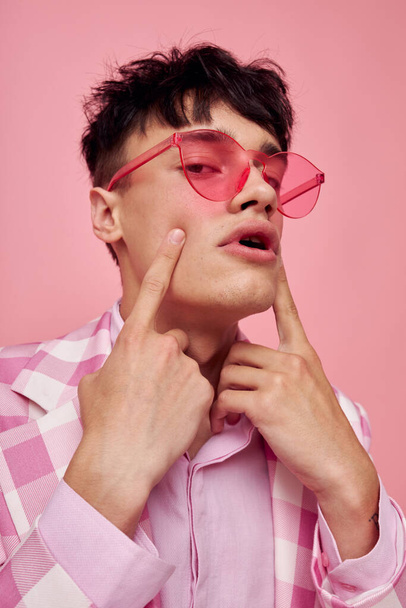 Photo of romantic young boyfriend fashionable pink sunglasses jacket posing model studio - Zdjęcie, obraz