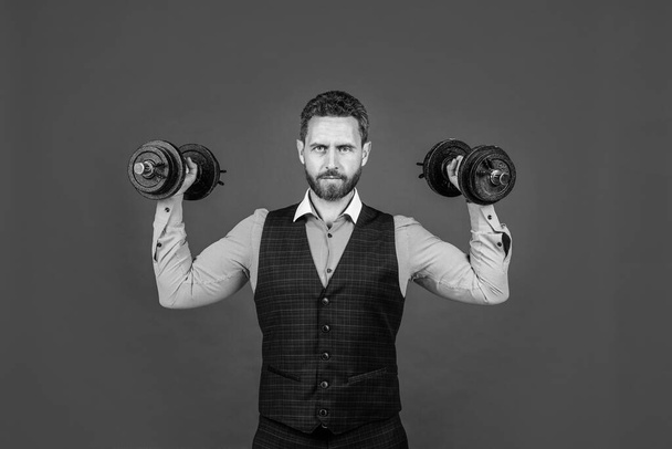 Work hard. Strong employee lift dumbbells red background. Building business. Career training. Challenge and endurance. Physical strength. Stand strong - Valokuva, kuva