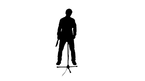 silueta de un músico tocando sobre un fondo blanco - Metraje, vídeo