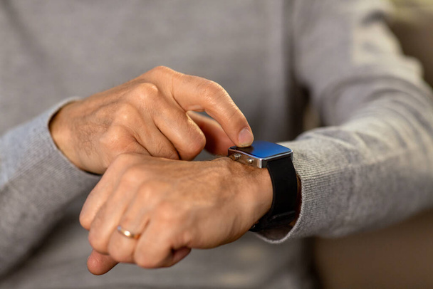 close up of senior man hands with smartwatch - Foto, imagen