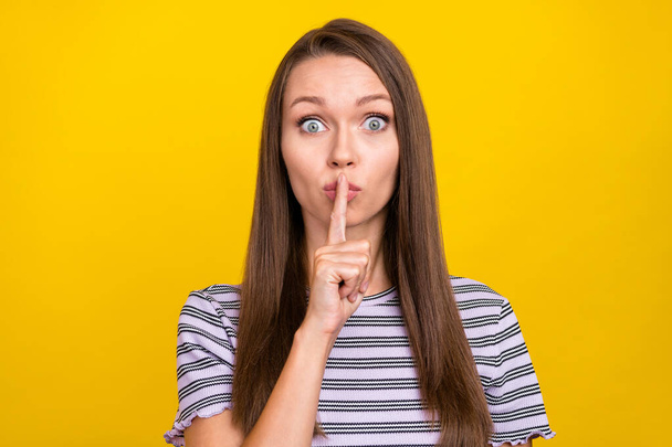 Photo of amazed shocked young woman hold finger lips face secret tell rumor isolated on yellow color background. - Φωτογραφία, εικόνα