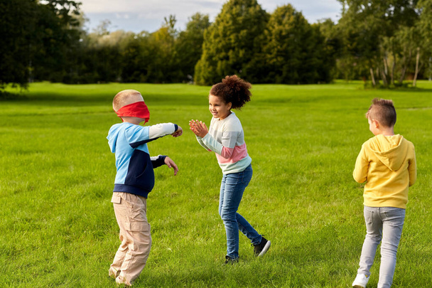 happy children playing and running at park - Fotó, kép