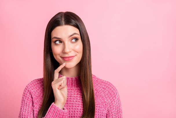 Photo of sweet thoughtful woman dressed knitted sweater smiling finger chin looking empty space isolated pink color background. - Φωτογραφία, εικόνα