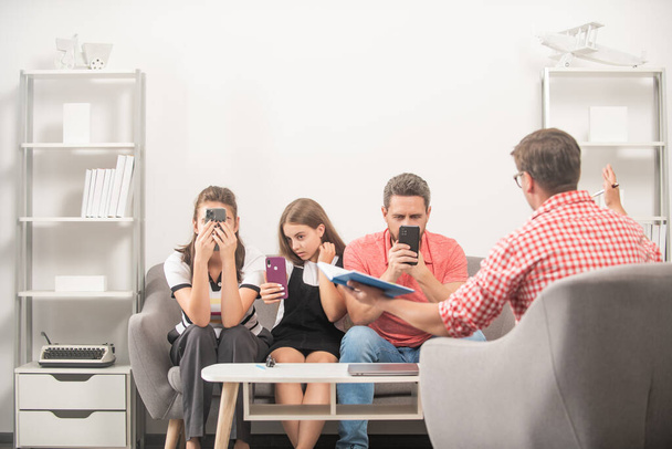 phone addicted mom dad and daughter. life insurance and adoption. - Photo, image