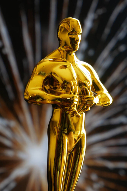 gouden man standbeeld op vuurwerk achtergrond, close-up - Foto, afbeelding