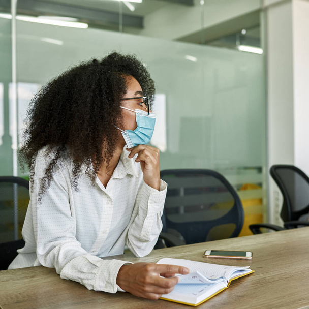Black female employee listening at company meeting - Photo, Image