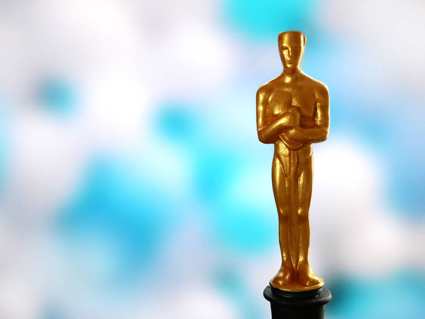 Hollywood Golden Oscar Academy award statue. Success and victory concept., closeup - Photo, Image