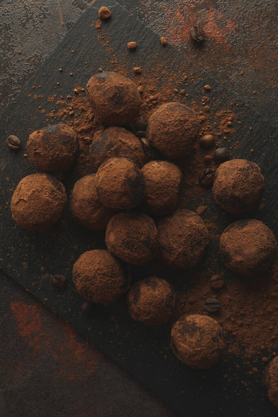 Concept of sweets with truffles on dark textured background - Zdjęcie, obraz