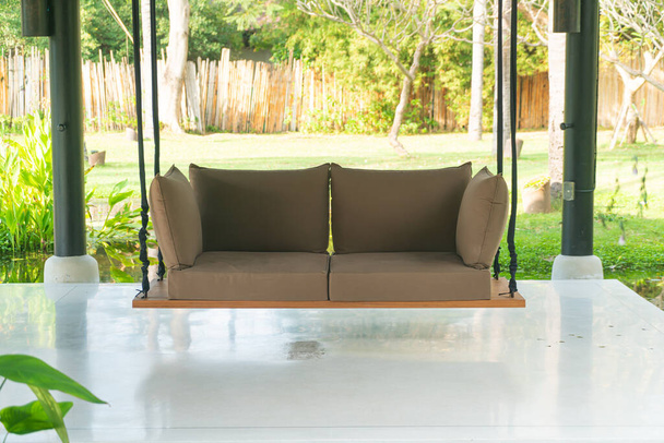 empty sofa swing in garden for relax time - Фото, зображення