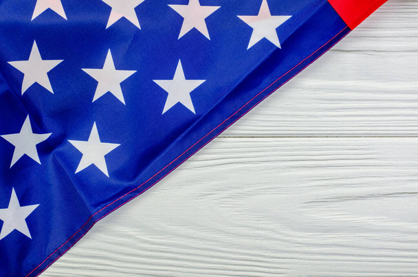 Part of american flag on white wooden table, copy space - Photo, image