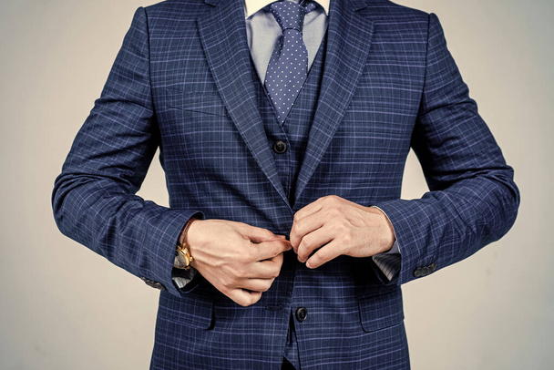 Buttoning up male vested blue suit with tie in formal fashion style grey background, formalwear - Foto, Imagem